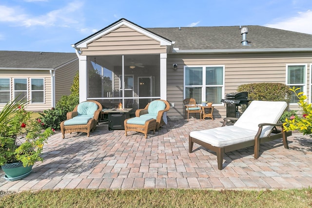 view of patio / terrace with area for grilling and a sunroom