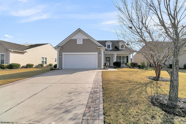 view of front of house with a garage, a front lawn, a porch, and driveway