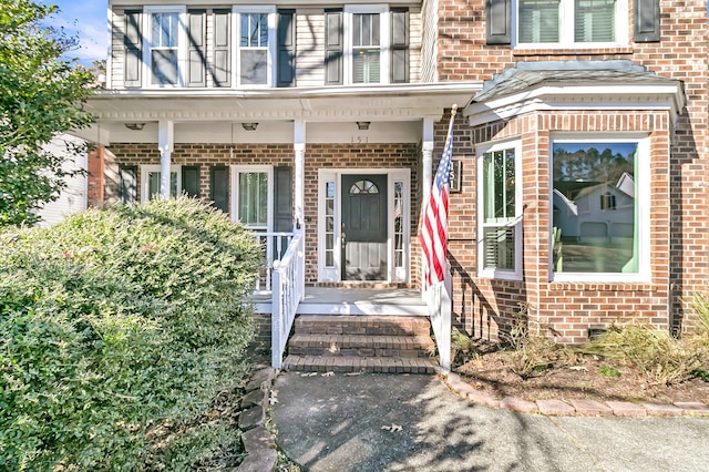 doorway to property with covered porch