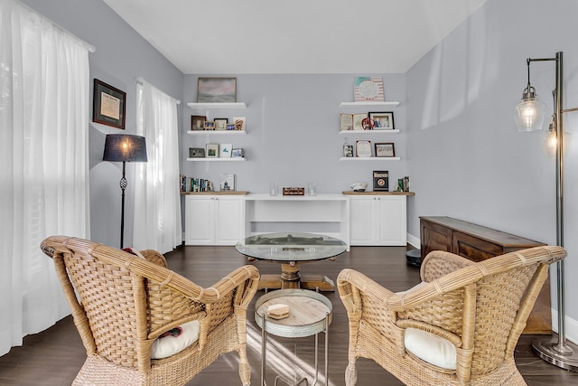 sitting room with dark hardwood / wood-style floors