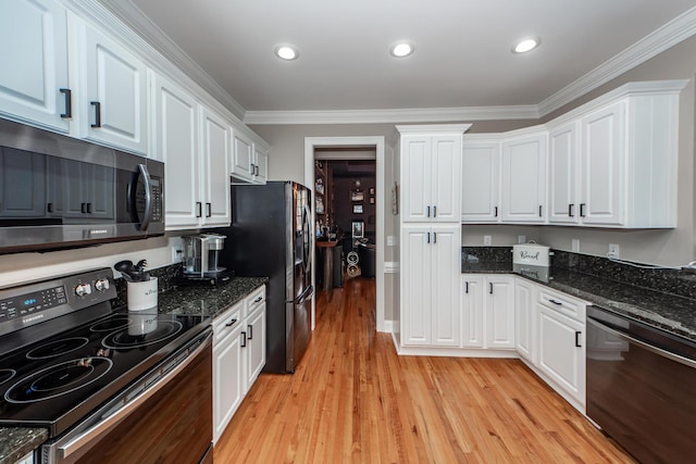 kitchen with light wood-style flooring, recessed lighting, white cabinetry, appliances with stainless steel finishes, and crown molding