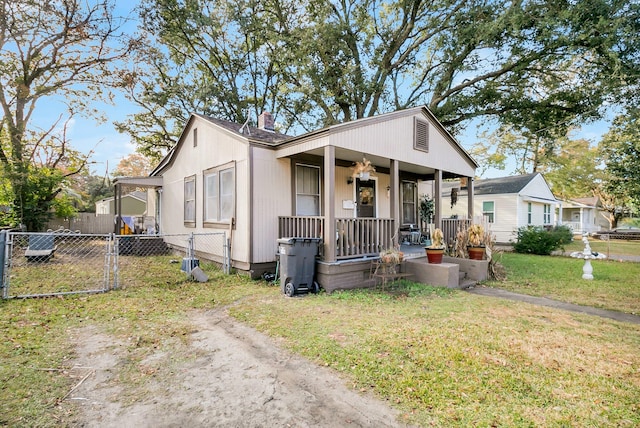 bungalow featuring a porch and a front yard