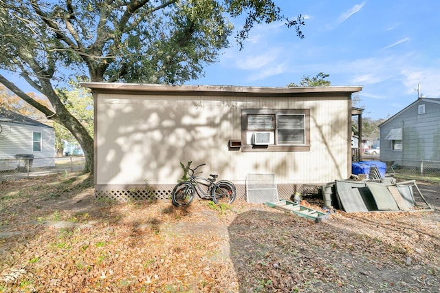 rear view of property with cooling unit