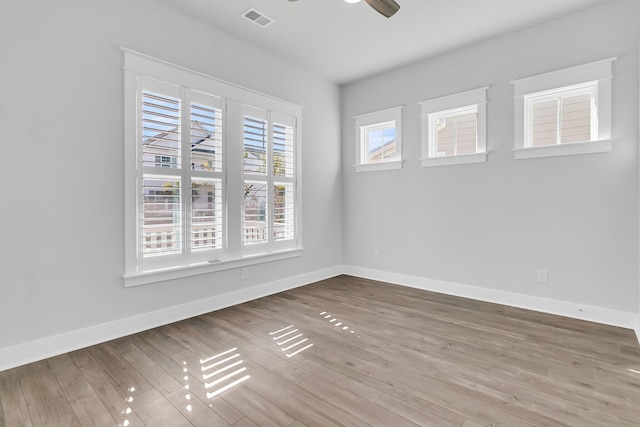 spare room featuring ceiling fan and hardwood / wood-style flooring