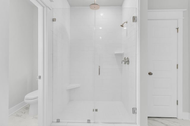 bathroom with walk in shower and toilet