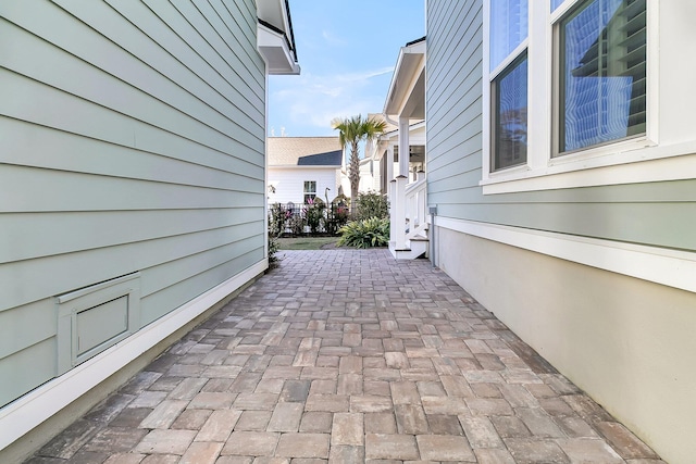 view of side of home with a patio area