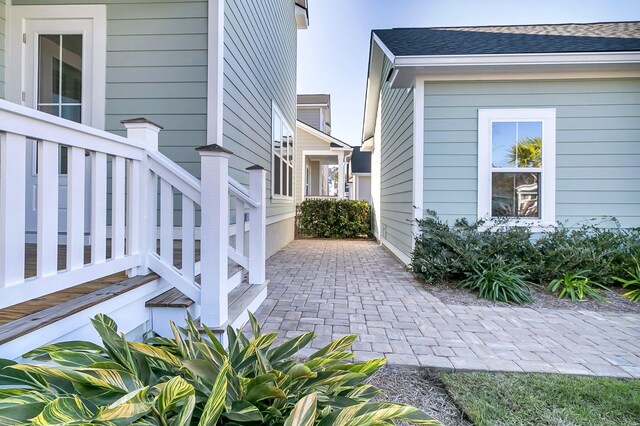 view of side of property with a patio