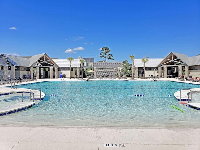 view of swimming pool with a patio area