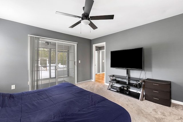 bedroom with ceiling fan, light carpet, and access to outside