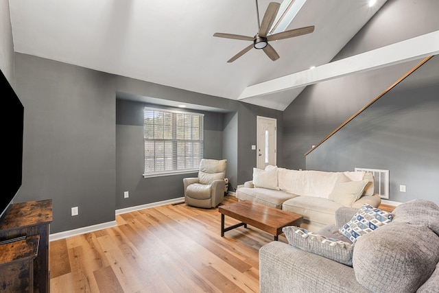 living room with high vaulted ceiling, light hardwood / wood-style floors, and ceiling fan