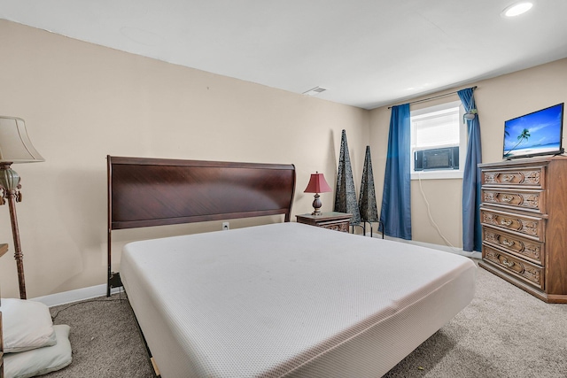 bedroom with carpet flooring and cooling unit