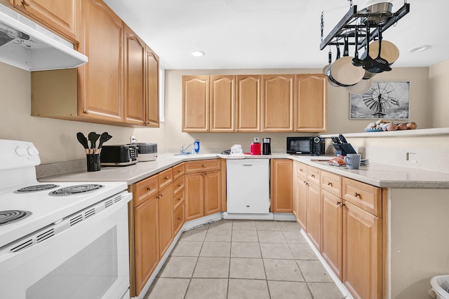 kitchen featuring sink, light tile patterned floors, light brown cabinetry, and white appliances