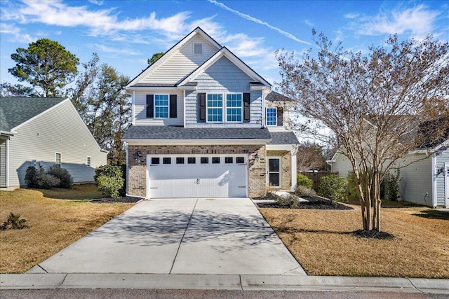 craftsman inspired home featuring a garage and a front lawn