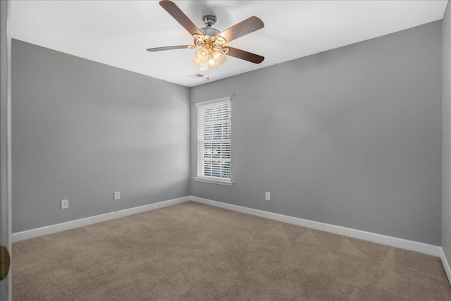 unfurnished room featuring light carpet and ceiling fan