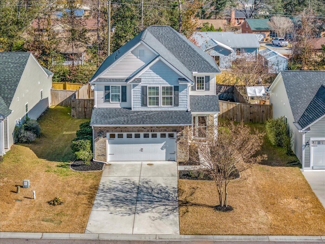 view of front of home featuring a front yard and a garage