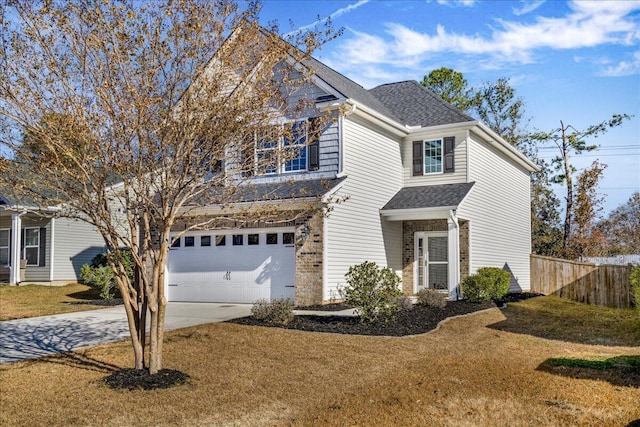 view of front property with a front yard and a garage