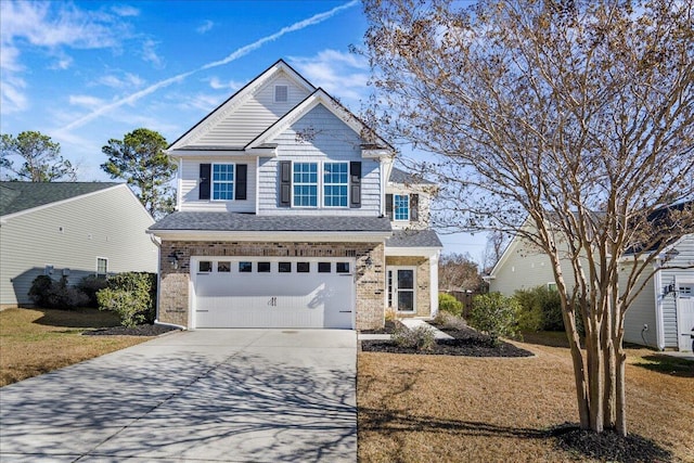 view of front of home featuring a garage and a front lawn