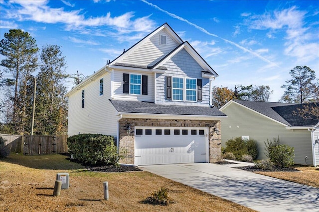 view of front facade with a front yard and a garage