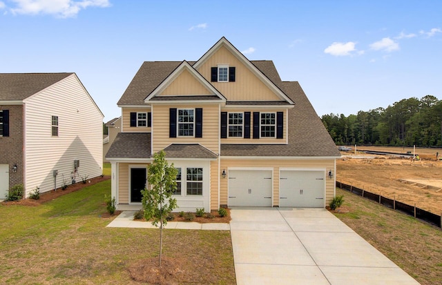 craftsman-style home featuring a garage and a front yard