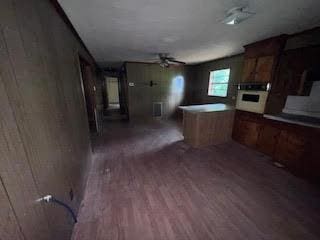 838 Ranch Hill Ln, Saint Stephen, SC 29479 - kitchen featuring wood finished floors, ceiling fan, and a peninsula