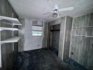 838 Ranch Hill Ln, Saint Stephen, SC 29479 - misc room with unfinished concrete flooring and ceiling fan