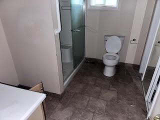 838 Ranch Hill Ln, Saint Stephen, SC 29479 - full bathroom featuring toilet, a stall shower, and vanity
