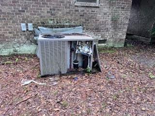 838 Ranch Hill Ln, Saint Stephen, SC 29479 - exterior view of central air condition unit and brick siding