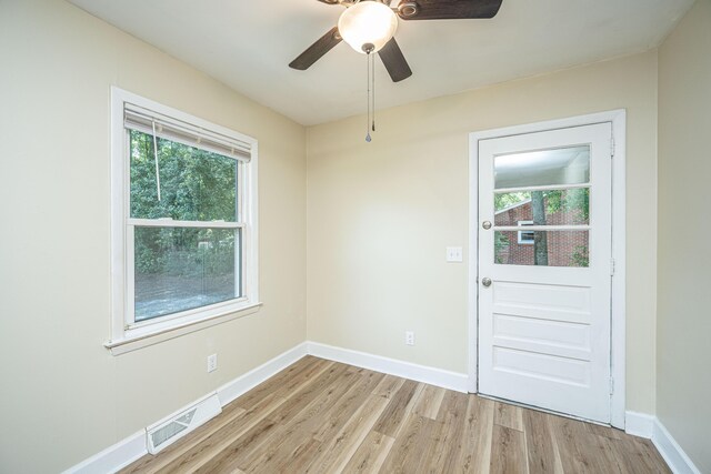 doorway to outside featuring ceiling fan, plenty of natural light, and light wood-type flooring