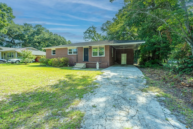 ranch-style house featuring a front lawn and a carport