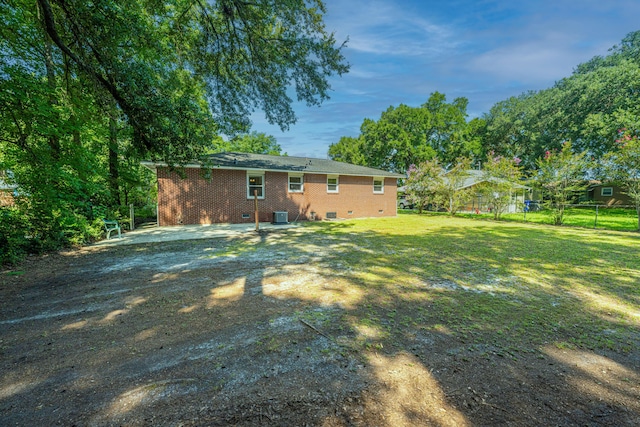 view of yard with central AC