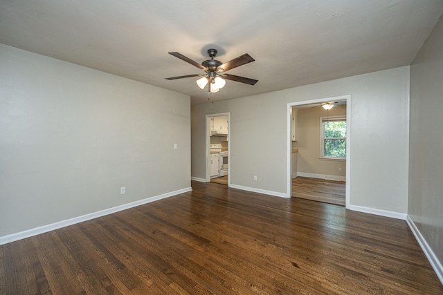 unfurnished room with ceiling fan and dark wood-type flooring