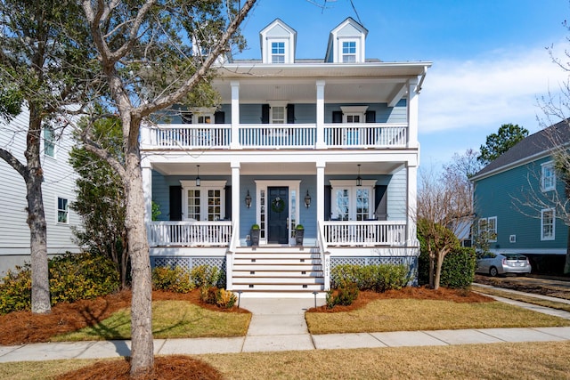 view of front facade with covered porch and a balcony