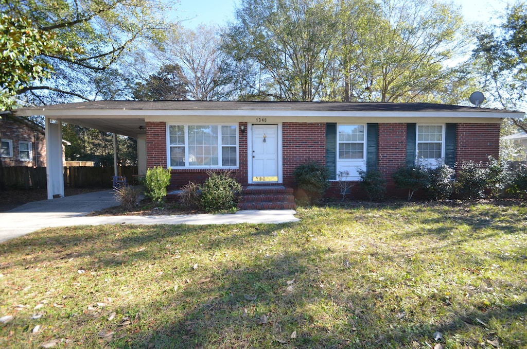 1340 Ashley Hall Rd, Charleston, SC 29407 - ranch-style home featuring a front lawn, brick siding, driveway, and a carport