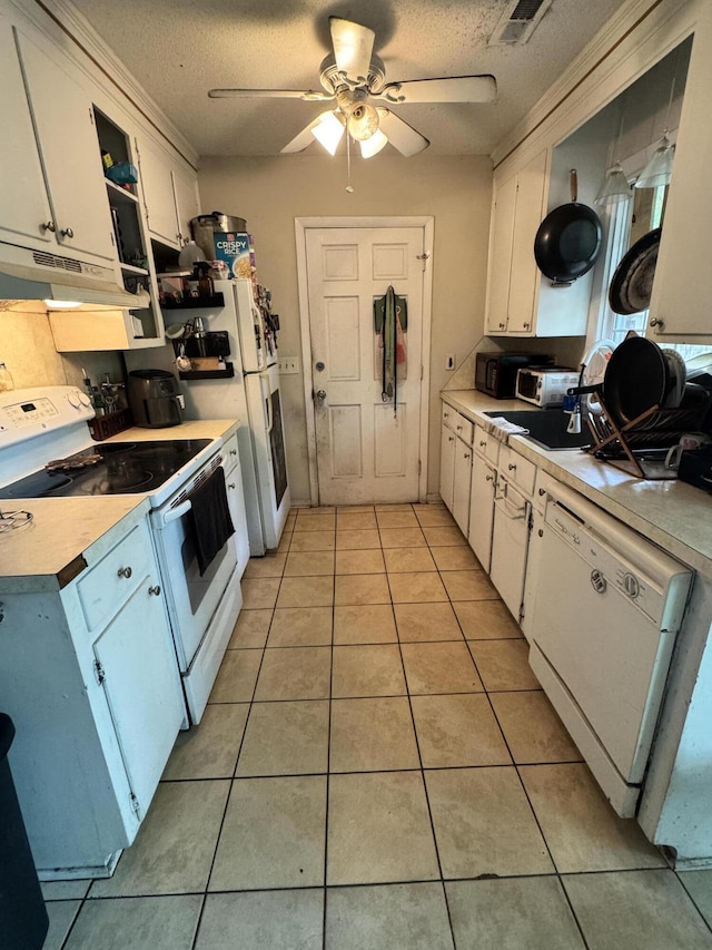 1340 Ashley Hall Rd, Charleston, SC 29407 - kitchen featuring light tile patterned floors, white appliances, light countertops, and white cabinets