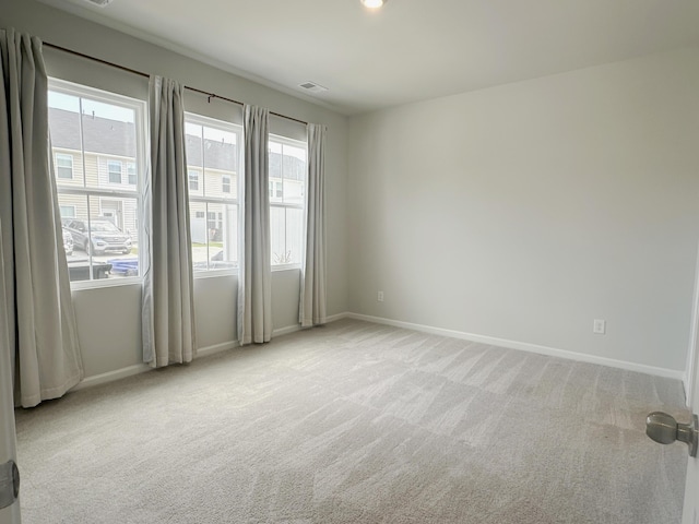 1443 Central Ave, Summerville, SC 29483 - carpeted empty room with healthy amount of natural light and baseboards