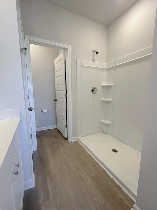 1443 Central Ave, Summerville, SC 29483 - bathroom with a shower, toilet, vanity, and wood finished floors