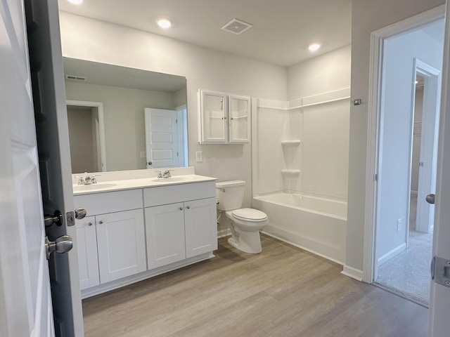 1443 Central Ave, Summerville, SC 29483 - full bath with wood finished floors, toilet, double vanity, recessed lighting, and bathing tub / shower combination