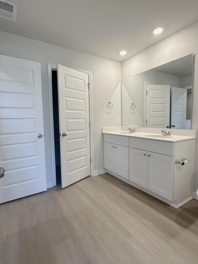 1443 Central Ave, Summerville, SC 29483 - bathroom featuring double vanity, wood finished floors, baseboards, and recessed lighting
