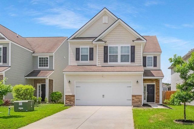 9923 Honeylocust Ln, Ladson, SC 29456 - view of front of house with concrete driveway, a garage, a shingled roof, and stone siding