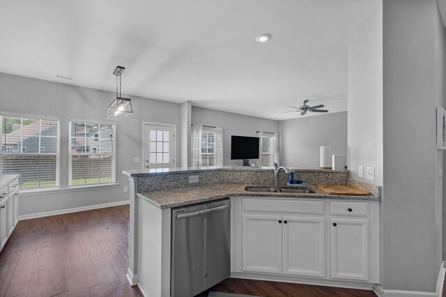 9923 Honeylocust Ln, Ladson, SC 29456 - kitchen with stainless steel dishwasher, a sink, a peninsula, ceiling fan, and light stone counters