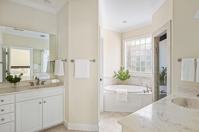 bathroom featuring tile patterned flooring, vanity, baseboards, ornamental molding, and a bath