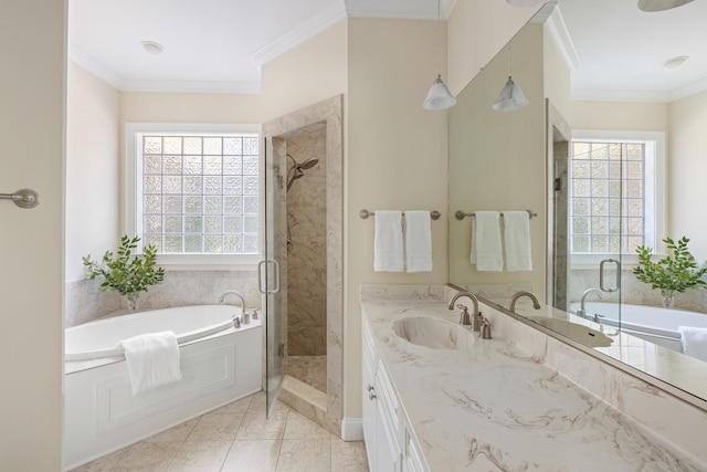 bathroom featuring a sink, ornamental molding, a shower stall, a bath, and double vanity