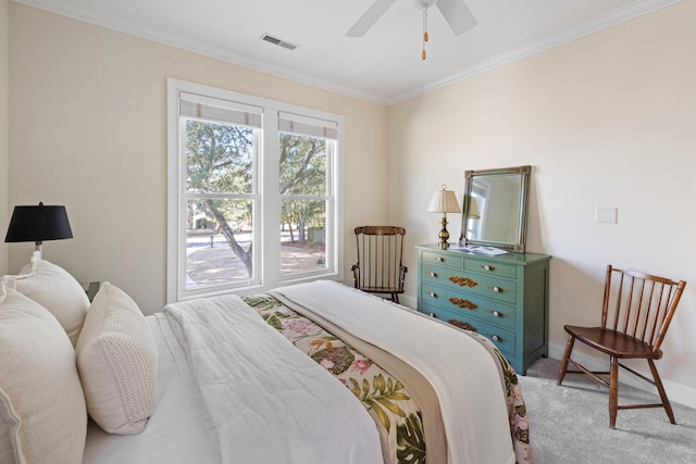 bedroom featuring baseboards, visible vents, a ceiling fan, light colored carpet, and ornamental molding