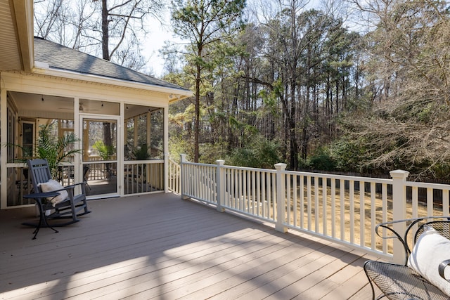 wooden terrace with a sunroom