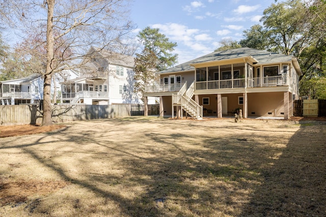 rear view of property featuring crawl space, fence, stairway, and a wooden deck