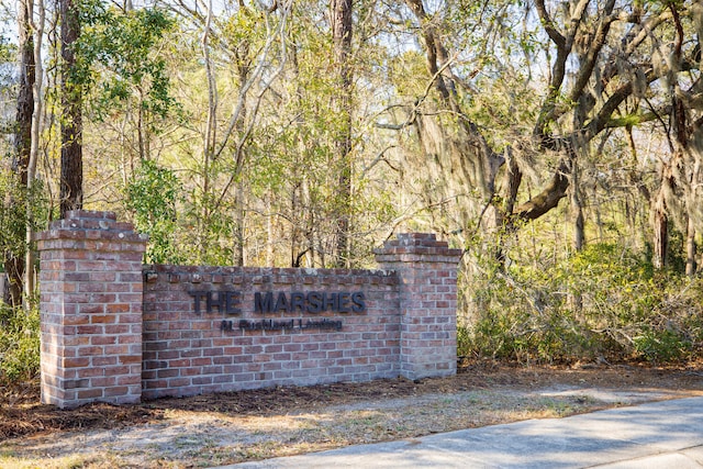 community sign with a view of trees