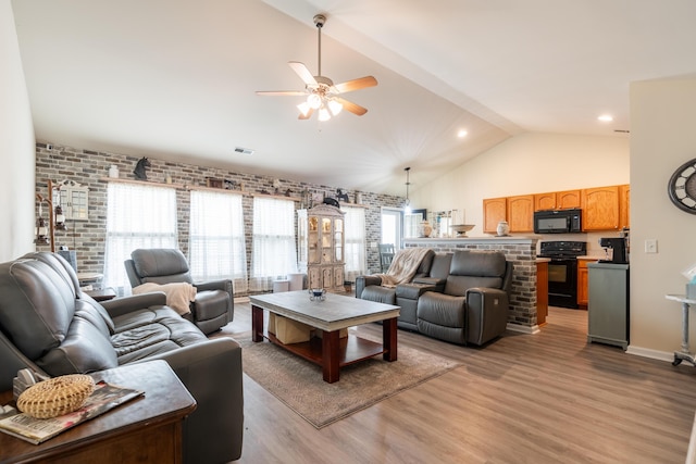137 Salem Creek Dr, Goose Creek, SC 29445 - living room featuring vaulted ceiling, a ceiling fan, light wood finished floors, brick wall, and recessed lighting