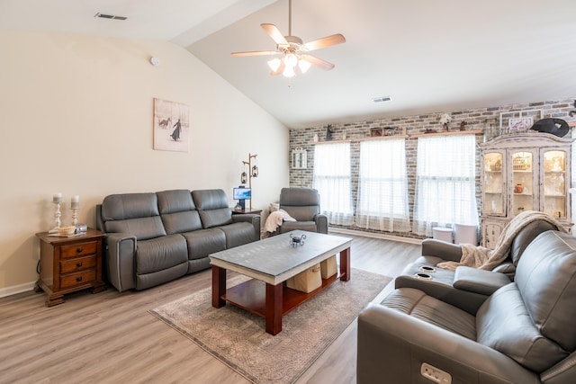 137 Salem Creek Dr, Goose Creek, SC 29445 - living area featuring brick wall, ceiling fan, light wood-style flooring, and vaulted ceiling