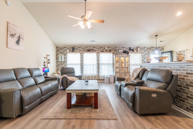 137 Salem Creek Dr, Goose Creek, SC 29445 - living room with vaulted ceiling, brick wall, light wood-type flooring, and a ceiling fan