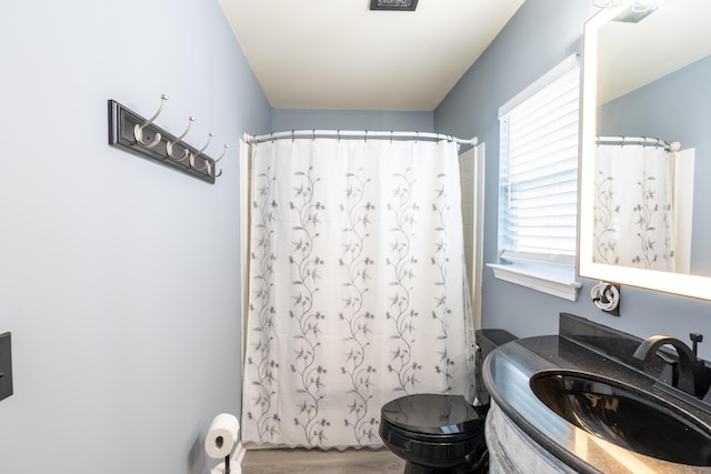 137 Salem Creek Dr, Goose Creek, SC 29445 - full bathroom with vanity, wood finished floors, and a shower with shower curtain